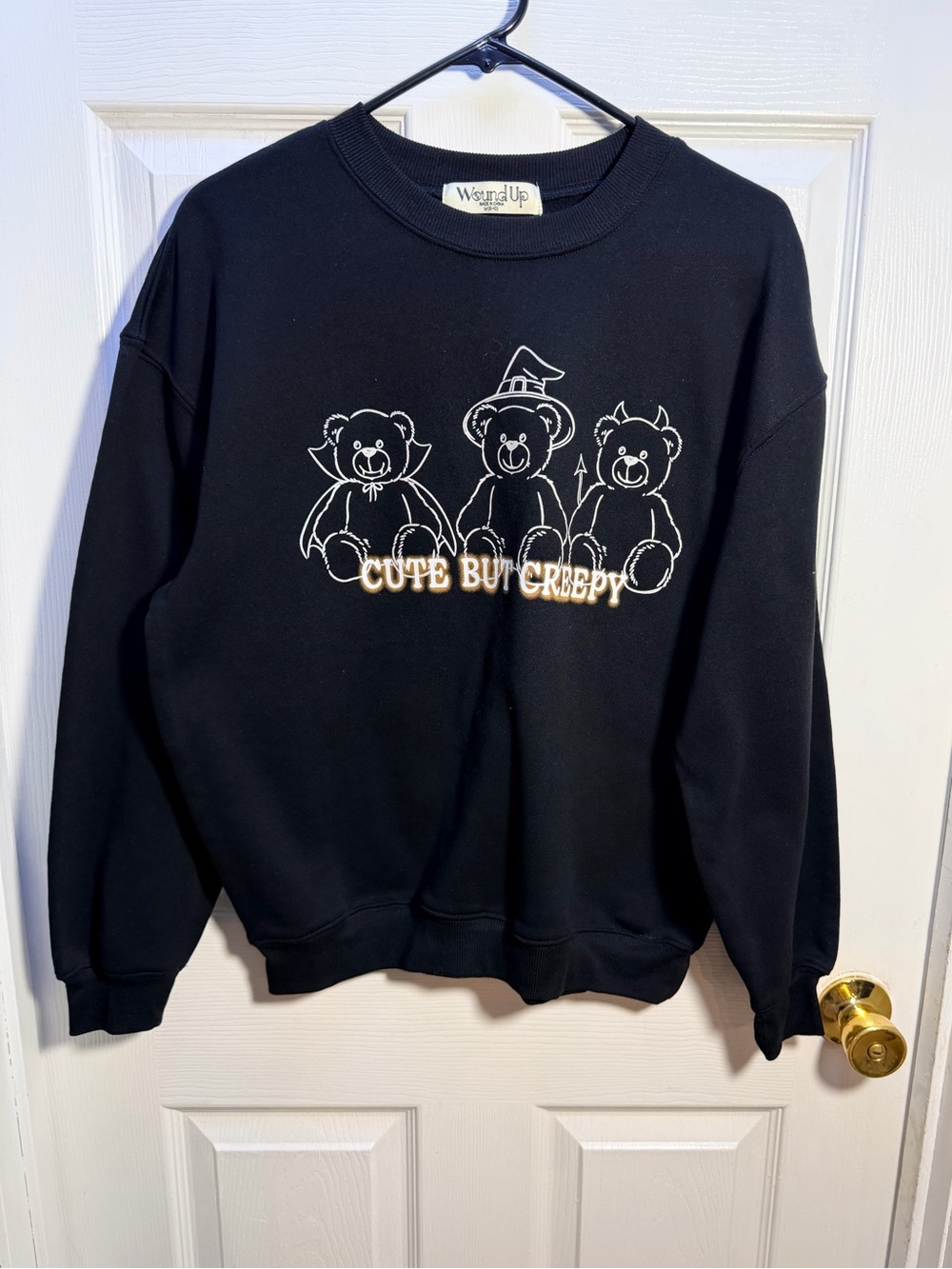 Wound Up Black Crewneck Sweatshirt with White & Cream Embroidery